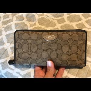 Large Coach wallet. 8”L x 4”T x 1”W